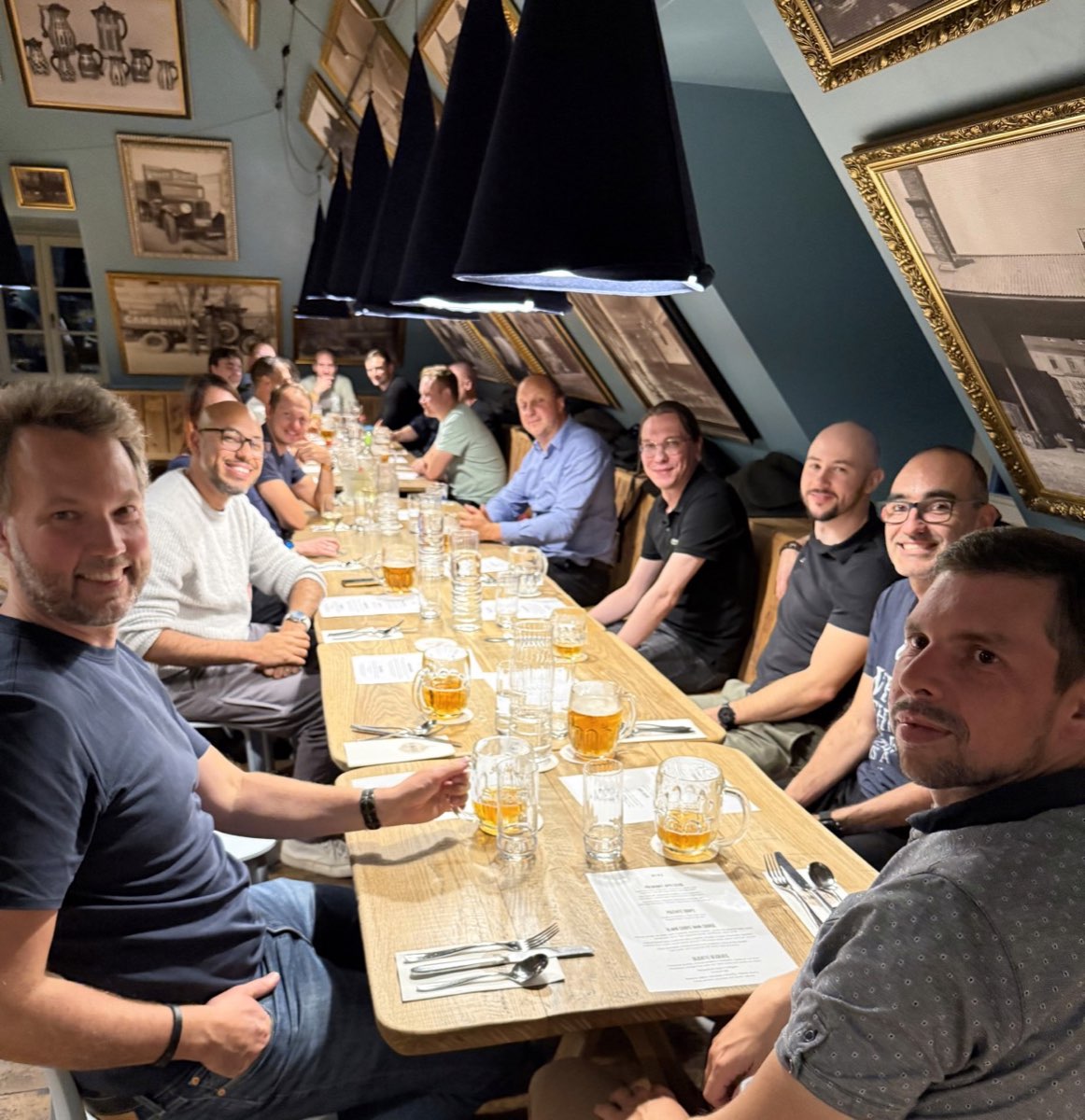 The team gathered around a long table